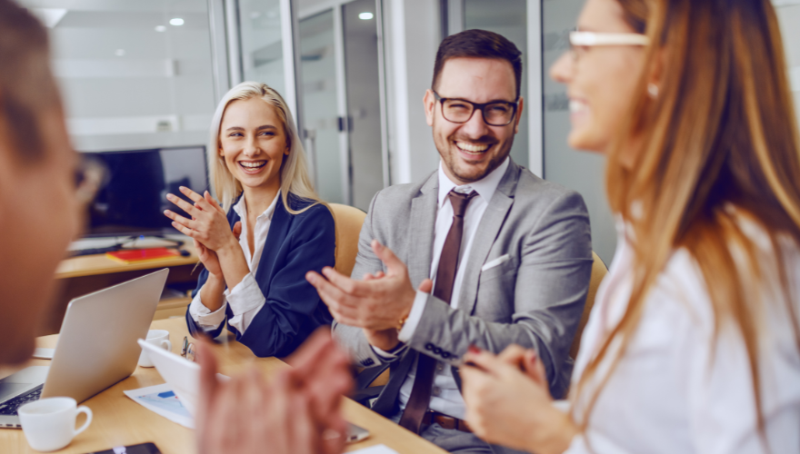 Stock photo of business colleagues clapping.