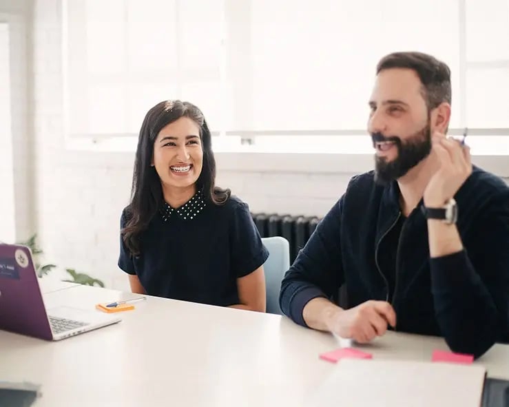 Happy colleagues in a meeting