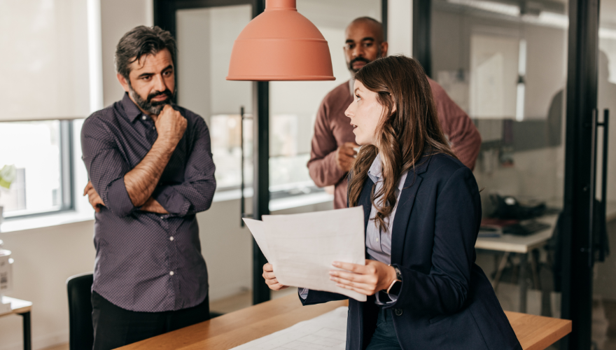 Group of office workers reviewing papers