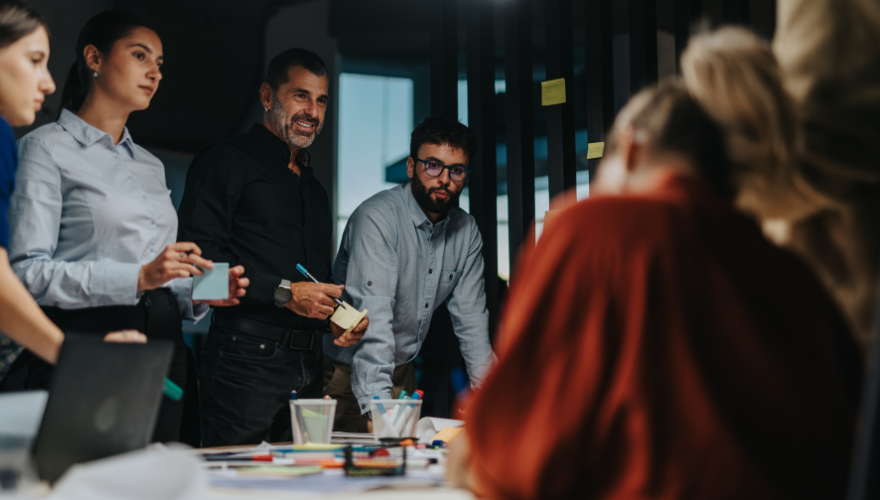 Group of employees discussing strategy and engagement in office