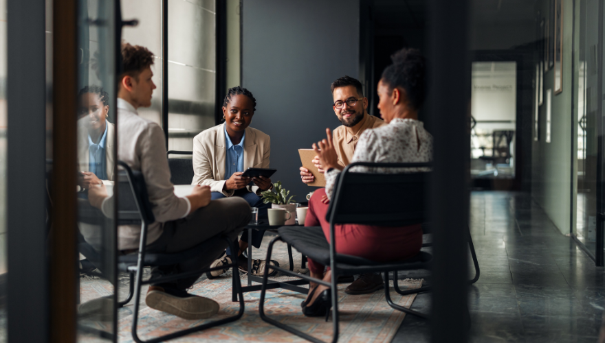 Group of employees and leaders around the table