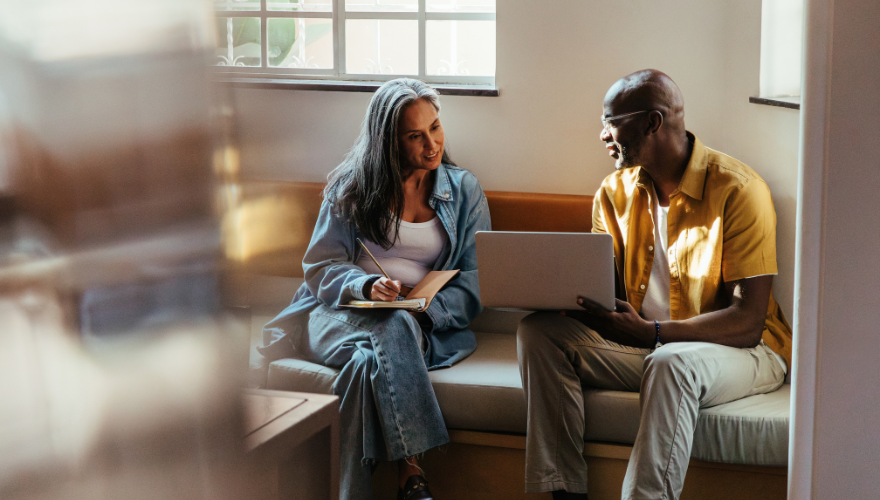 Group of people talkng on a sofa at work