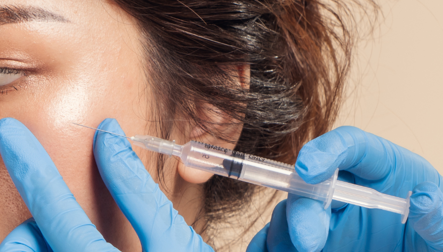 Young woman receiving cosmetic injectable