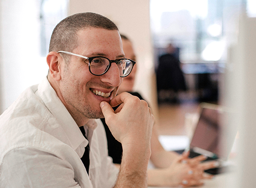 Photo of a smiling man in a meeting