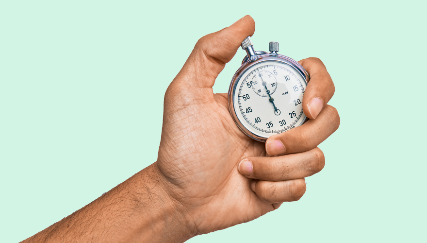 Person holding a stopwatch timer