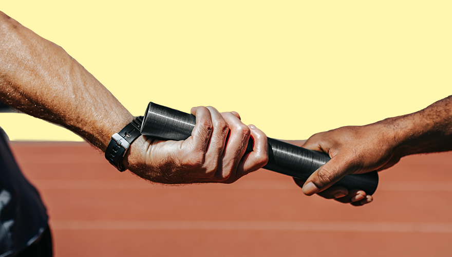 Relay race closeup of hands passing the baton