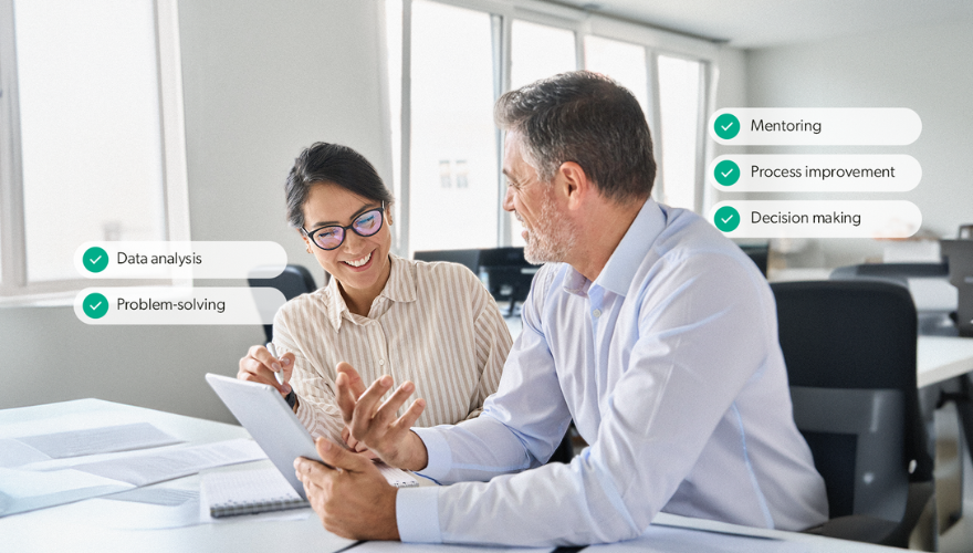 Photo of two coworkers talking, with their unique skills appearing behind them
