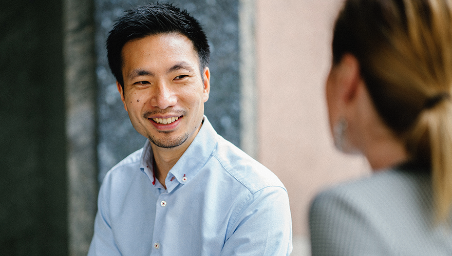 Photo of two colleagues talking