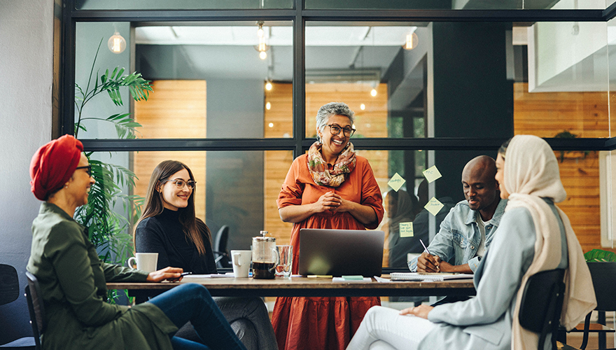 A photo of a team meeting in an office