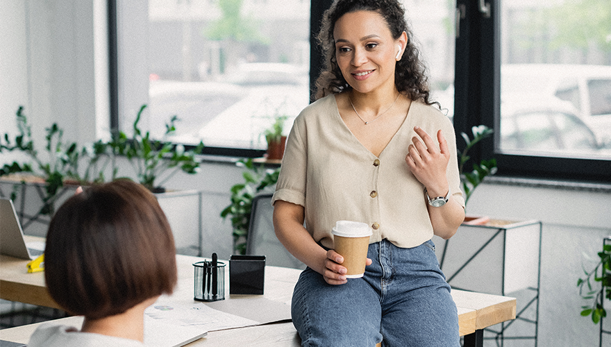 A photo of two women at work
