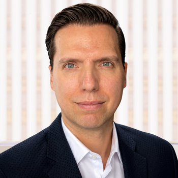 Headshot of Spiro Papanicolaou.